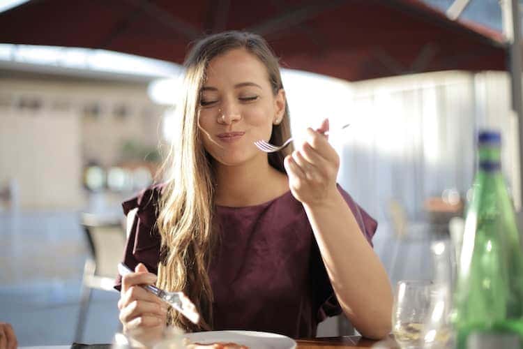 Woman eating by herself