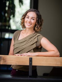 Therapist Shannon Lamb standing outdoors wearing a brown top