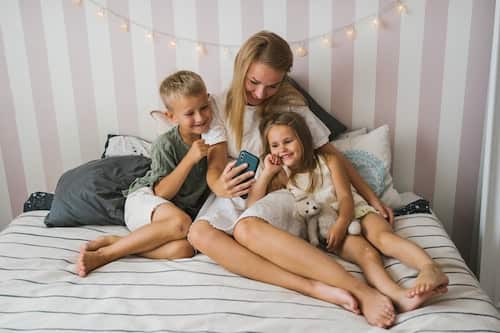 Mom and children talking to family on phone