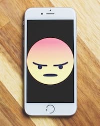icon of the anger emoticon on a smart phone