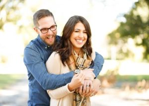 happy couple standing outdoors