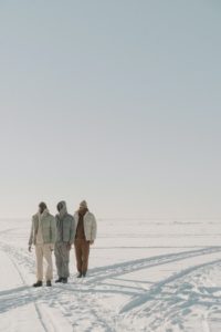 3 men in cold climate