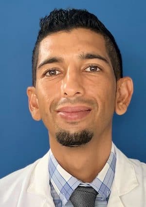 Nurse Practitioner Abraham Ashton indoors' headshot