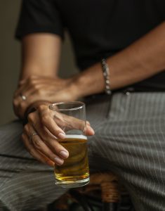 Man holding glass of beer